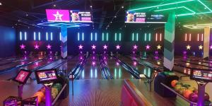 a bowling alley with lanes and stars on the wall at Westgate Two-Bedroom Homestay Suite in Westgate on Sea +12 photos