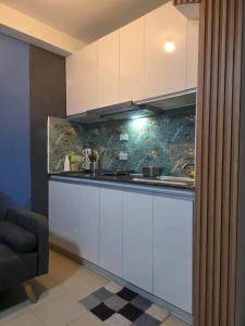 Kuchyň nebo kuchyňský kout v ubytování Saekyung Condo 109