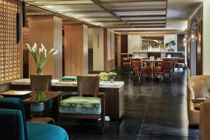 a restaurant with tables and chairs and a bar at Four Seasons Hotel Bogota in Bogotá