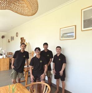 a group of men posing for a picture in a room at Tropical Almond Villa in Uluwatu +62 photos