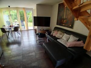 a living room with a couch and a table at Bungalow in Kühlungsborn in Kühlungsborn