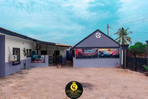 a building with a sign on the side of it at Classic Chillout in Oke Ogun