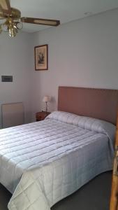 Postel nebo postele na pokoji v ubytování Departamentos corazón