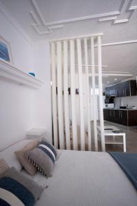 a white bed with pillows on it in a room at Costa Libertad, Mesa del mar in Tacoronte +27 photos