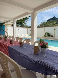 a blue table with flowers on it on a patio at hotel bocas del cauca in Tarso +52 photos
