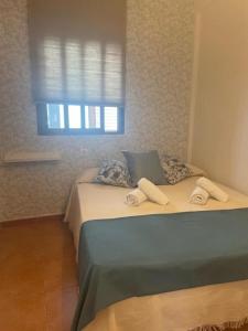Giường trong phòng chung tại Apartamento Reina Mercedes