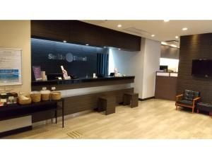 a lobby of a store with a counter and aasteryasteryasteryasteryasteryastery at Smile Hotel Kokura - Vacation STAY 67776v in Kitakyushu