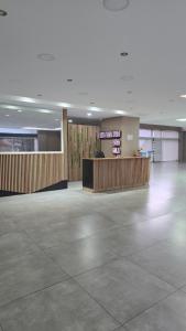 an empty lobby with a waiting area in a building at Bariloche Studio Center Leg.1068 in San Carlos de Bariloche