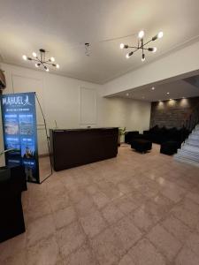 a large room with a stage and a podium at Hotel Alameda in Mendoza +16 photos