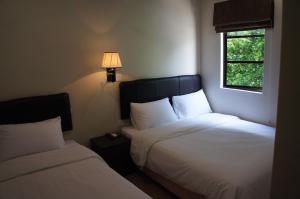Postel nebo postele na pokoji v ubytování Hotel Hong