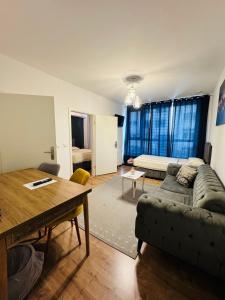 a living room with a couch and a table at HR RoomS in Hannover