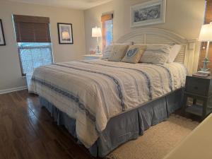 a bedroom with a large bed with a white bedspread at Canal Home Dearborn-Indian Mound in Englewood +45 photos
