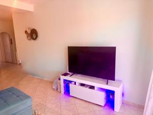 a flat screen tv on a white entertainment center at Ethereal Apartment in Xylokastro