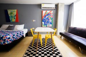 Voodi või voodid majutusasutuse Casa Bugambilia - Alma Hotels toas