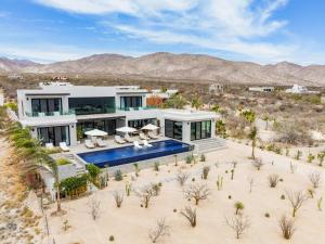 an aerial view of a house in the desert at New 5BR-6BTH Lap Pool, Pickleball, Jacuzzi Sauna ,Cold Plunge, Gym, Bocce in El Sargento