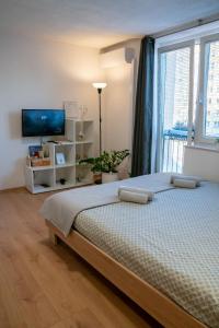 Postel nebo postele na pokoji v ubytování Small but cozy apartment