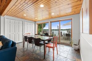 a dining room with a table and chairs at Cozy Pet-Friendly Condo l Pool l Dock l Walk to Parks in Oxbow