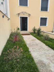 a walkway leading to the door of a house at T2 modern - 10 min from Paris in Colombes