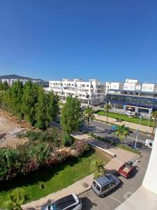 an aerial view of a parking lot in a city at Azure Luxe Retreat in Martil