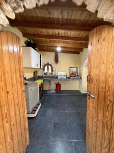 a kitchen with an open door to a room at Vila panoramic sur la mer in Essaouira