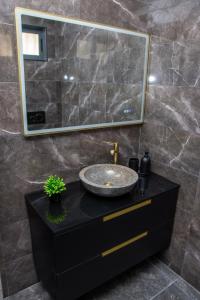 a bathroom with a sink and a mirror at Cantinho do Ze Padeiro in Tabuaço +20 photos