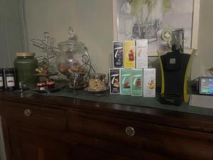 a counter with items on top of a dresser at Le Mirail in Brugnac +10 photos