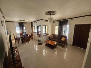 a living room with a couch and a table at Ananda in Jarabacoa