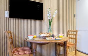 a table with a bowl of food and two candles on it at Superbe Maison Avec Piscine in Parentis-en-Born