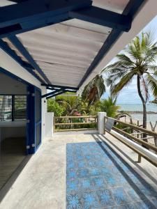 a view of the beach from the balcony of a house at Casa Manglar in Tolú
