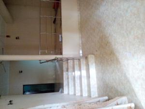 a light hanging from a ceiling in a room at THSVM Traveler in Nikawatawana