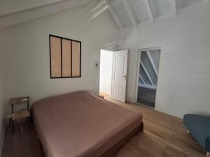 Katil atau katil-katil dalam bilik di Appartement neuf a 150 metres de la mer wifi