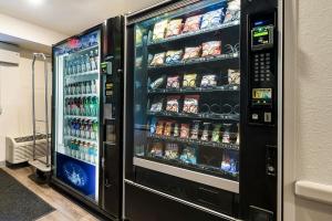 a refrigerator filled with lots of drinks and soda at Extended Stay America Select Suites - Ocala in Ocala