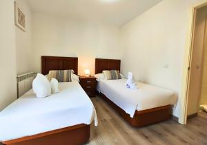 Giường trong phòng chung tại Apartamento Peña Telera Las Margas Golf