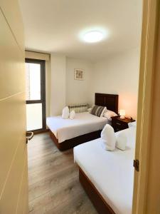 Giường trong phòng chung tại Apartamento Peña Telera Las Margas Golf