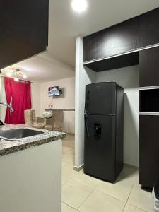 Η κουζίνα ή μικρή κουζίνα στο Apartamento Turistico Brisas Vallenatas