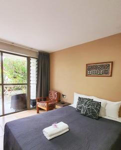 Letto o letti in una camera di Vaea Hotel Samoa