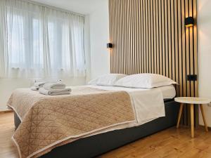 Postel nebo postele na pokoji v ubytování Apartment Skadenca