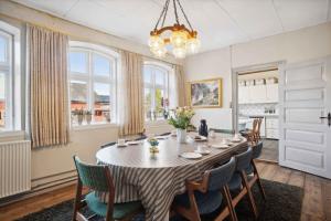 a dining room with a table and chairs at 580 M2 Countryside Idyll With Activity Room in Haderslev