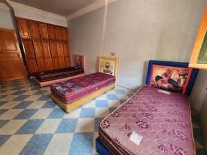 Postel nebo postele na pokoji v ubytování Ets koudane