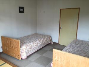 Postel nebo postele na pokoji v ubytování Uchihan