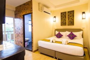 Postel nebo postele na pokoji v ubytování Suan Dok Gate Guesthouse