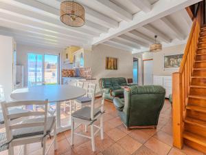 a kitchen and living room with a table and chairs at Maison 3 chambres avec jardin, proche plage et centre, Biscarrosse-Plage - FR-1-521-35 in Biscarrosse-Plage