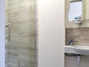 a bathroom with a sink and a shower at Elm - Uk11991 in Greenhill