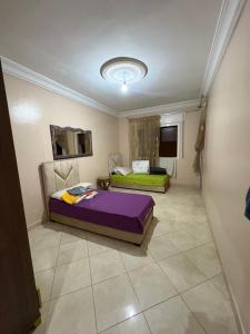 a bedroom with two beds in a room at DelTODOcerca in Tetouan