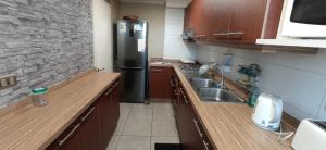 Η κουζίνα ή μικρή κουζίνα στο Habitación con baño privado y estacionamiento