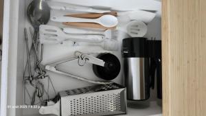 a drawer full of kitchen utensils and appliances at Bienvenue Chez Mymy! in Sept-Îles