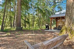 a wooden bench sitting in front of a cabin at Eco Friendly Tiny Container Home Retreat in Camas