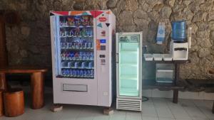 a vending machine with drinks in a room at SKYROCK VILLA SG LEMBING in Sungai Lembing