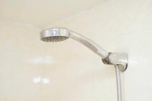 a shower with a shower head in a bathroom at Phương Anh 303DM2 in Hanoi +37 photos