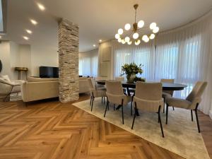 a dining room with a table and chairs at Sunny Coastal villa, luxury gateway! in Caesarea